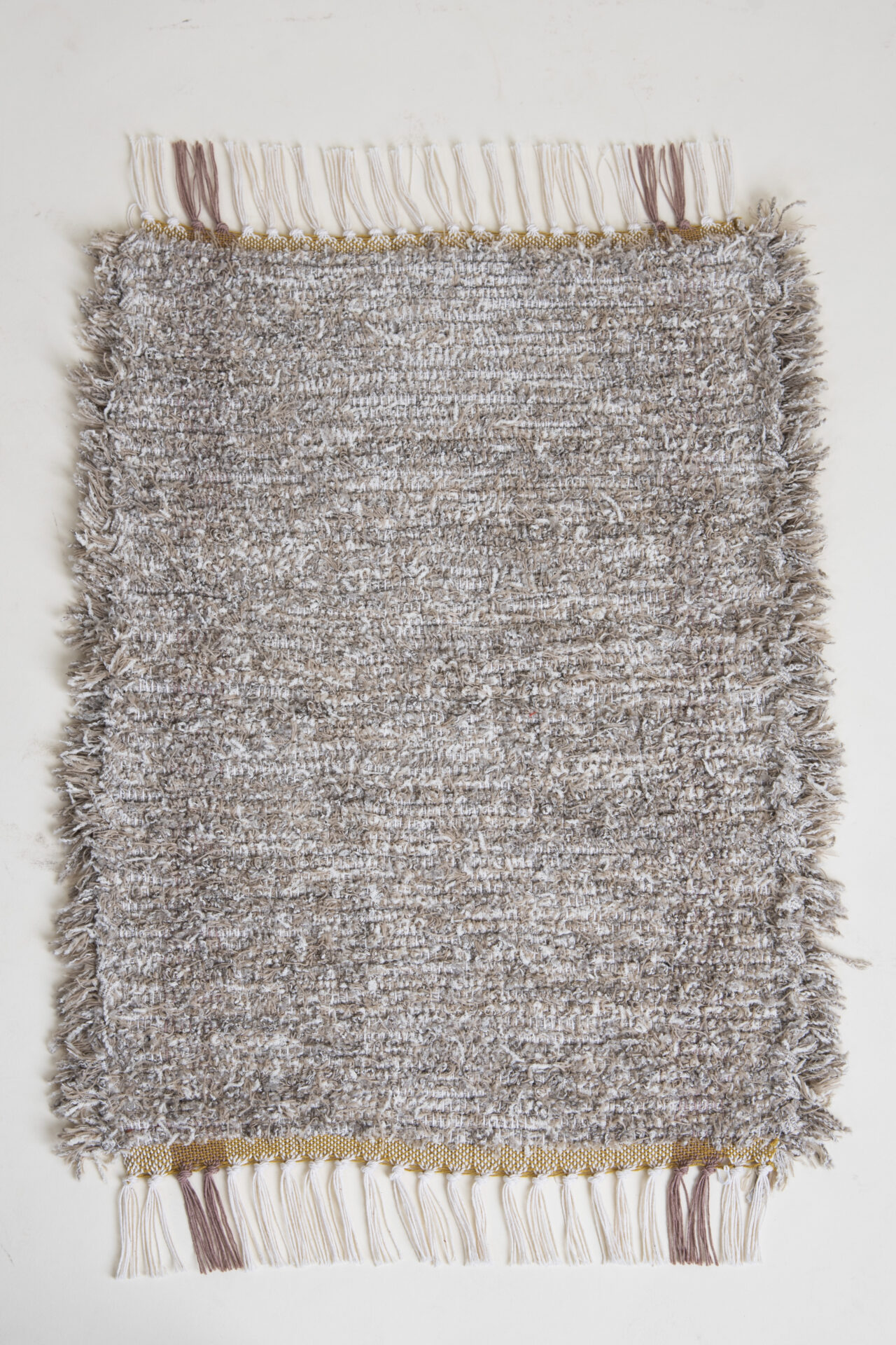 A grey & white color thread product A grey & white color thread product